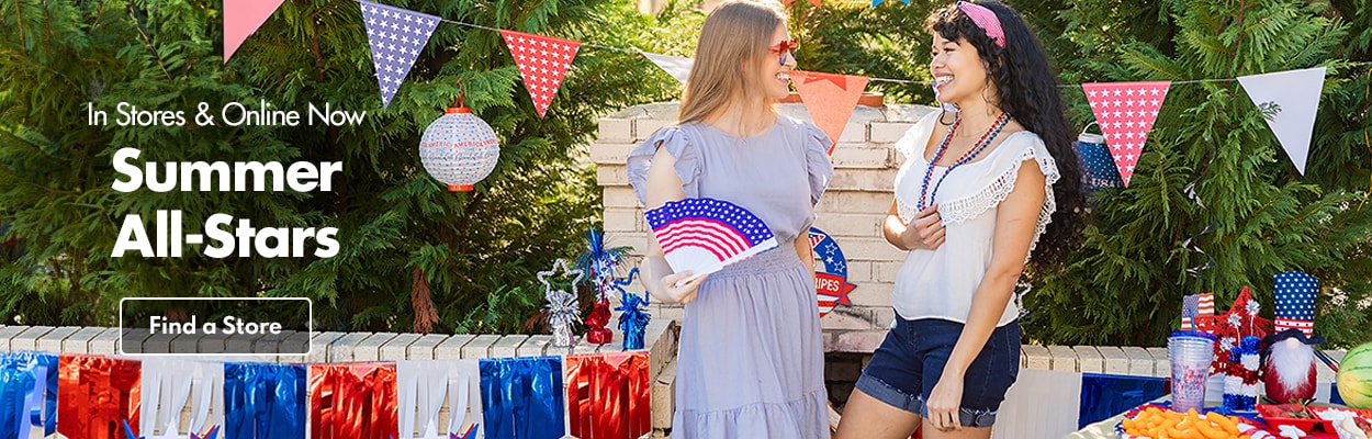 2 women wearing patriotic supplies at a party outside