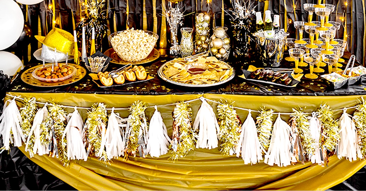 Food table, Roaring 20s Party. Background brick wall paper and