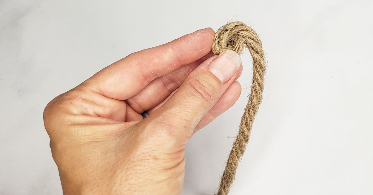 Hold holding nautical cord.