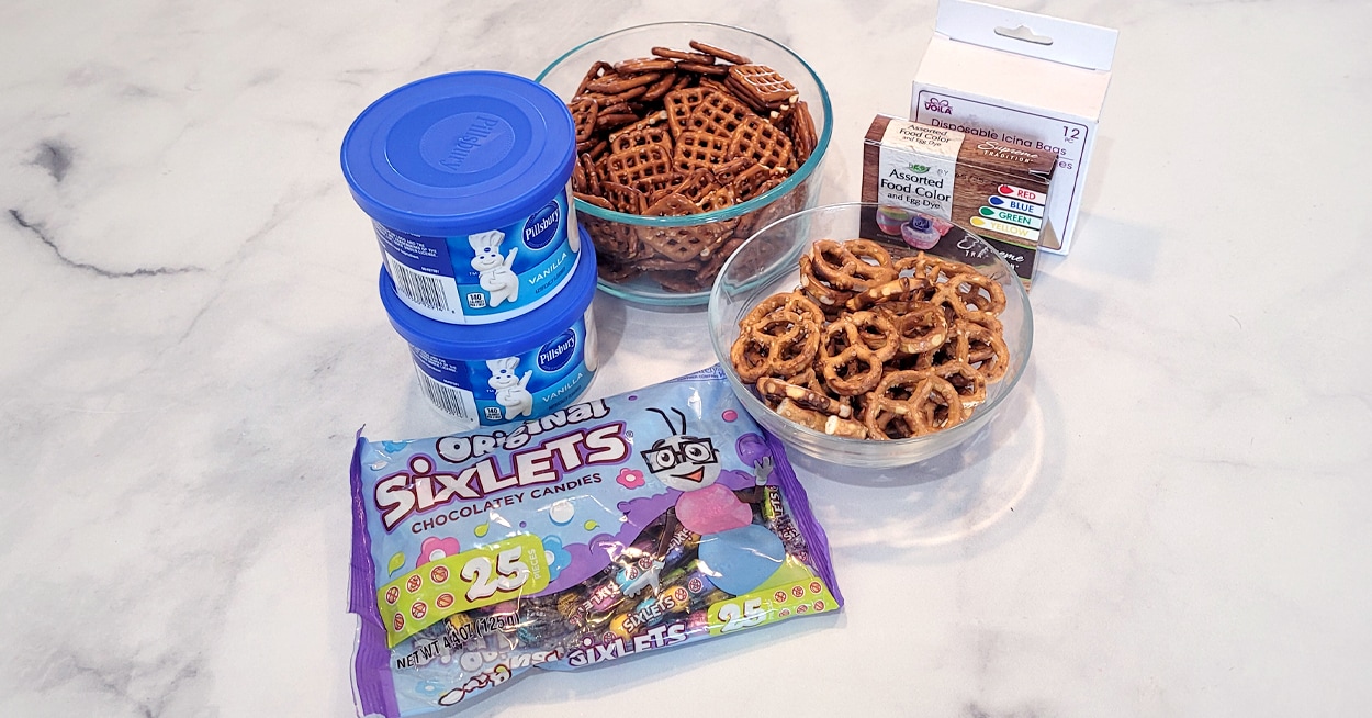 A bag of marshmallows, cookies, and a small bag of chocolate kisses.