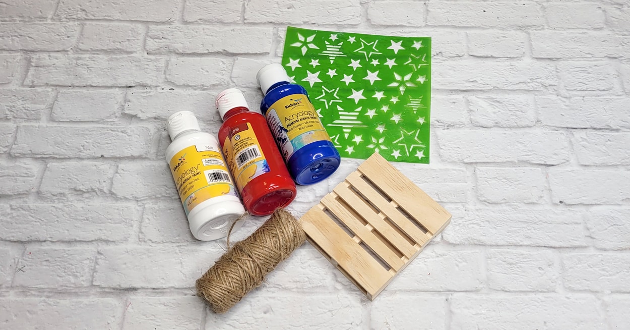 Red, white, and blue paint, twine, and a stencil.