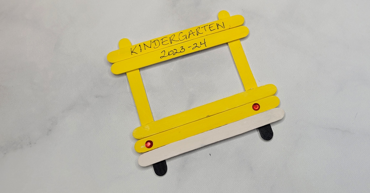 Frames made from craft sticks that are painted yellow to that look like