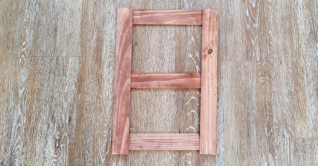 A small brown wooden ladder.