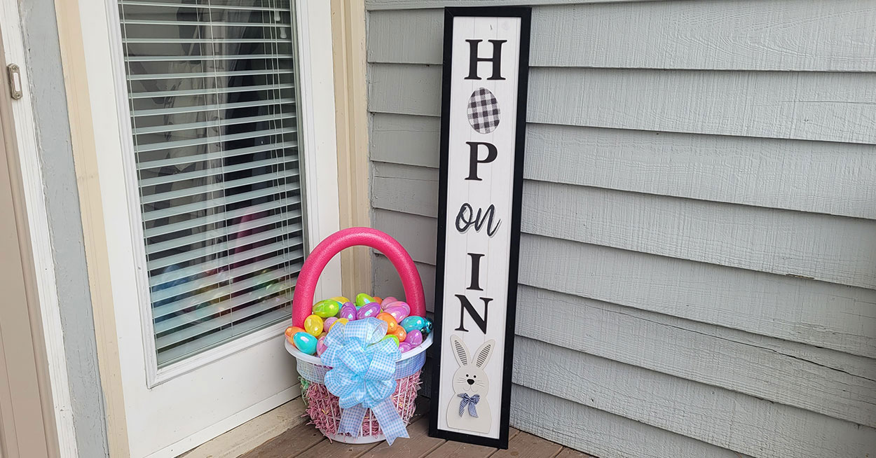 Colorful Dollar Tree DIY Easter basket made with a pool noodle, bow